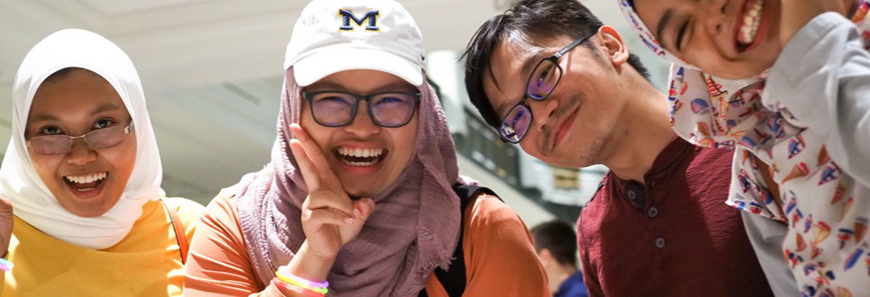 Students posing and smiling