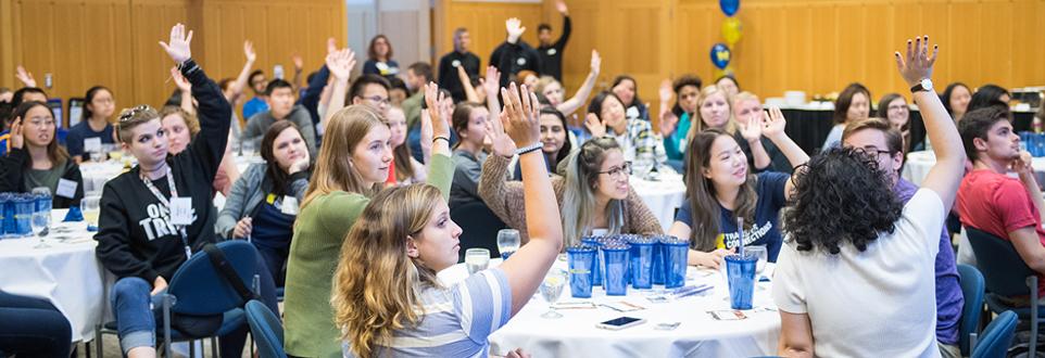 Students raising hands at a Transfer Connections event